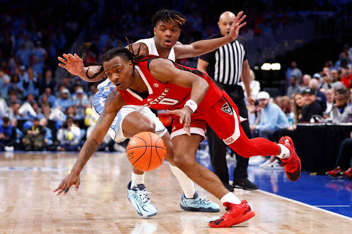 North Carolina State guard DJ Horne (0) dribbles past the North Carolina defense during the second half at Capital One Arena in Washington on March 16, 2024.